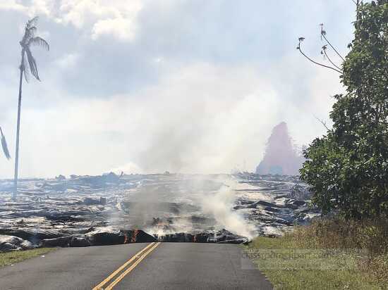 pahoehoe lava advancing onto road