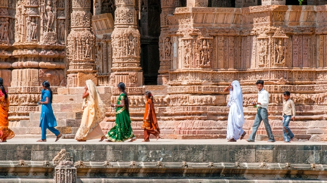 people walking along sun temple india