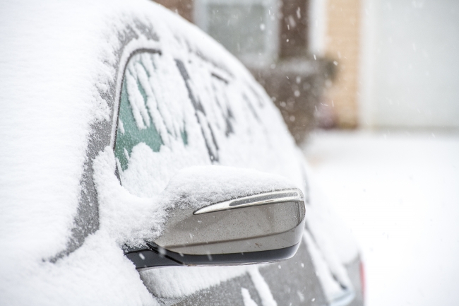 photo closeup of snow covered car