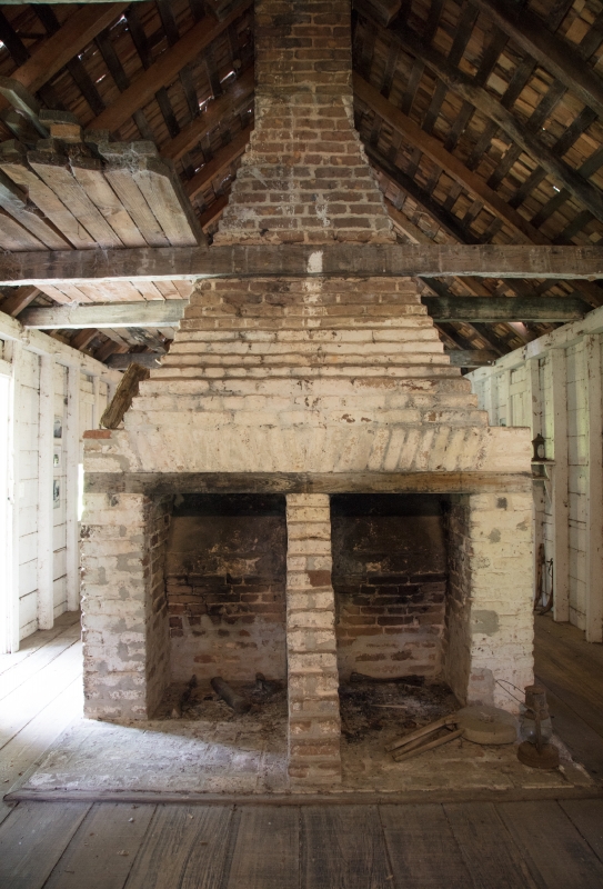 photo double fireplace inside the slave quarters at hopsewee pla