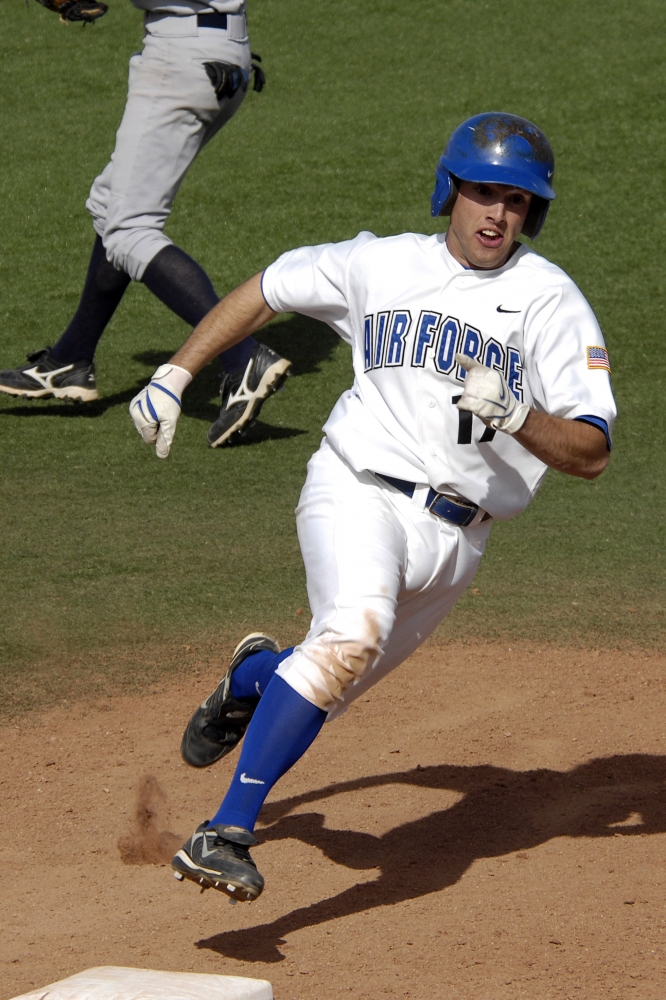 rounds third base headed for an RBI