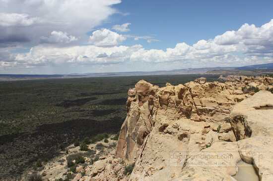 sandstone bluff overlooking extinct lava flows at El Malpais Nat