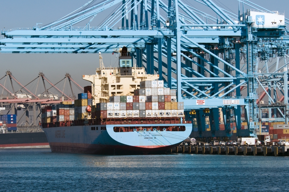 ship filled with containers near cranes