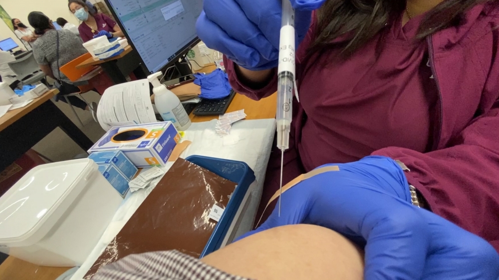 vaccination injection into an arm