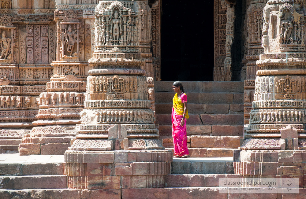 woman standing on the steps of the sun temple india
