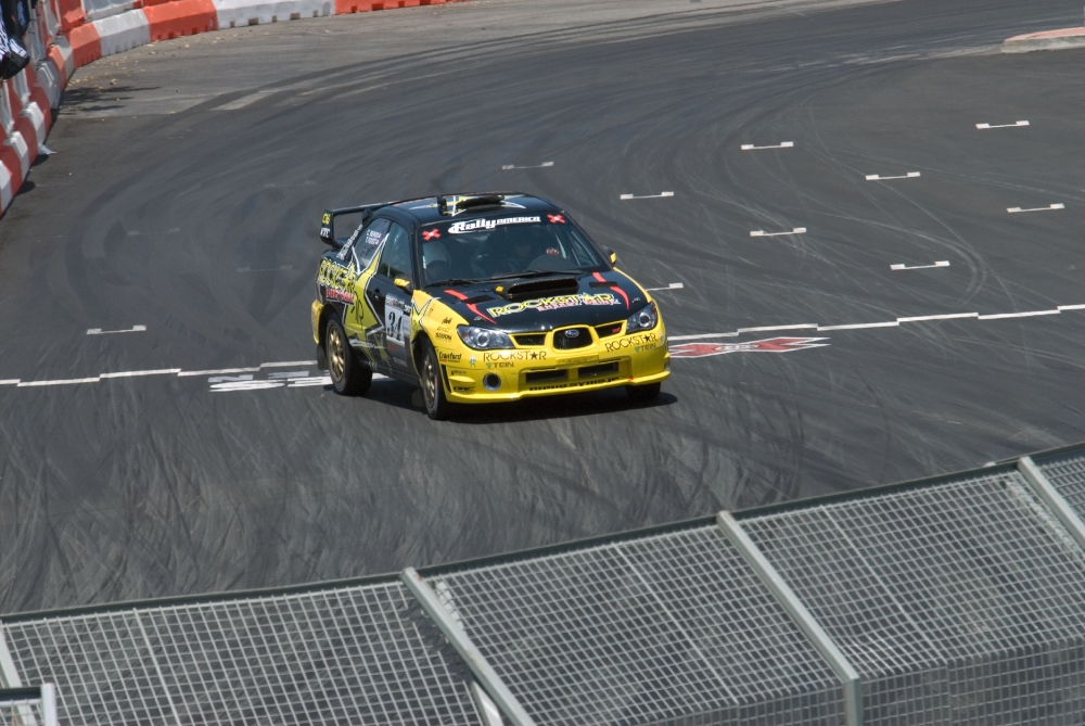 yellow car on track at rally race 099