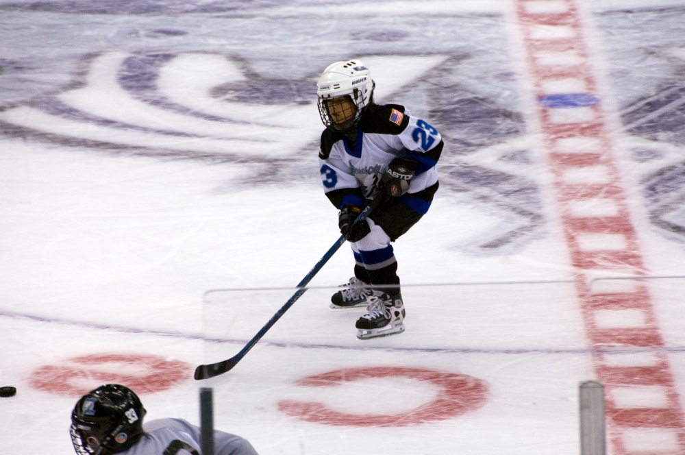 ice hockey players rink chasing puck Classroom Clip Art