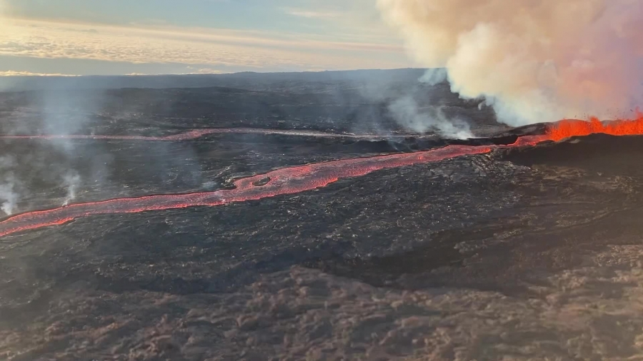 Footage of a geologist taking a sample of the Northeast Rift Zone eruption of Mauna Loa