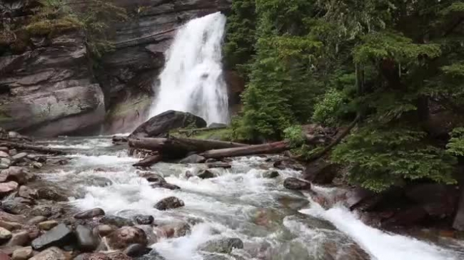 small waterfall in a rocky creek video