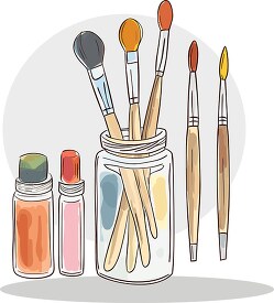 art supplies including brushes stored in a glass jar