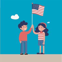 boy and girl holding an American flag on a clear day