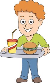 boy holding a tray of food with burger and drink