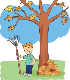 boy holding rack near pile of fall leaves clipart