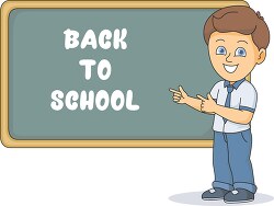 boy in front of chalk board showing back to school