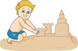 boy playing in sand creating large sandcastle