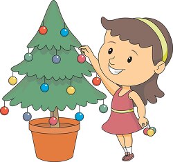 girl decorating christmas tree clipart