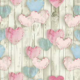 multicolored hearts in a pattern on a wooden plank background