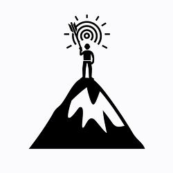 person standing on top of a mountain with a target