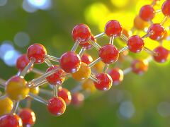 This 3D illustration depicts a colorful molecular structure with red and yellow spheres representing atoms.