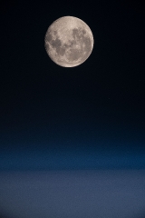 a full moon above the south pacific ocean