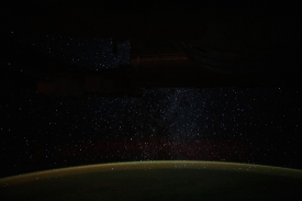 a starry milky way glitters above earth