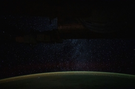 a starry nighttime background seemingly glitters down on earth