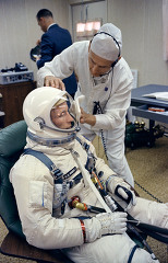 astronaut Edward White Gemini 4 pilot gets help with the donning