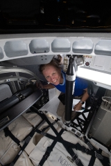 astronaut shannon walker loads cargo inside the spacex cargo dra