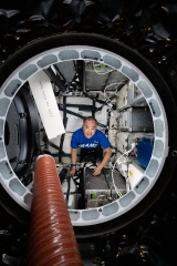 astronaut soichi noguchi loads cargo inside the spacex cargo dra