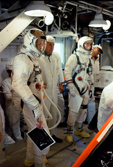 astronauts shown in the white room as they prepare to enter the 