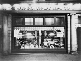 Automobiles in window of the Washington-Cadillac Co 1927