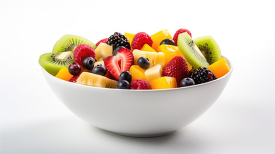 bowl of fresh and colorful mixed fruit salad in white bowl