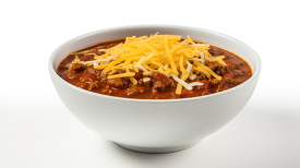 bowl of spicy chili with cheese