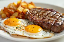 breakfast grilled steak with two fried eggs