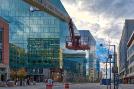 Building crane downtown denver reflection on windows photo