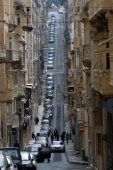cars line the narrow streets in the city center of Valletta Malt