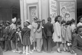 Children in front of moving picture theater Easter Sunday matine