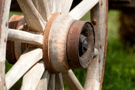 closeup of an old wooden wagon wheel 
