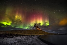 colorful night lights over the coast of iceland