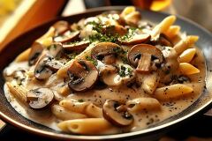 Creamy Mushroom Penne Pasta With Fresh Parsley Garnish