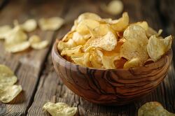 crispy golden potato chips in a bowl