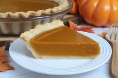 Delicious Pumpkin Pie Slice With Autumn Decorations