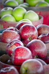 delicious red apples in baskets