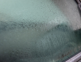 early morning dew on car window