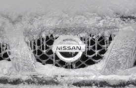 front of a car covered with snow and ice