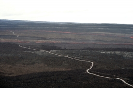helicopter overflight shows a lava flow cutting across the Mauna