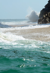 large waves crashing along the rocky beach mexico