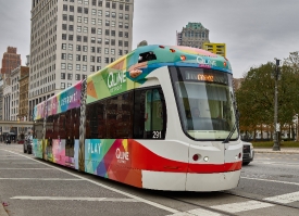 light rail cars comes to a stop in downtown Detroit Michigan