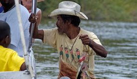 Man holds a fish caught in the river