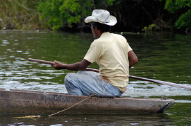 Man in a wooden boat